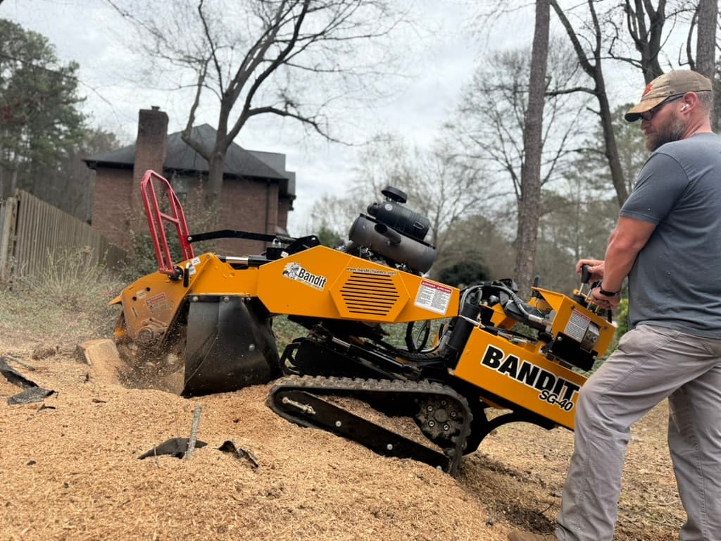 Nelson Stump grinding a stump with Bandit SG-40 in a residential backyard in Upstate SC